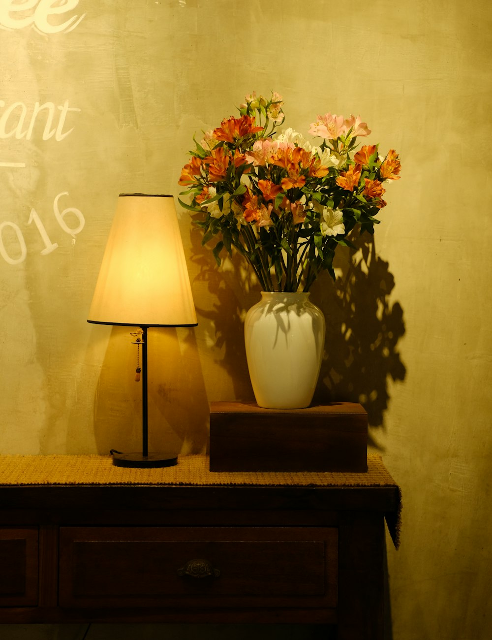 Lamp and flowers in warm light